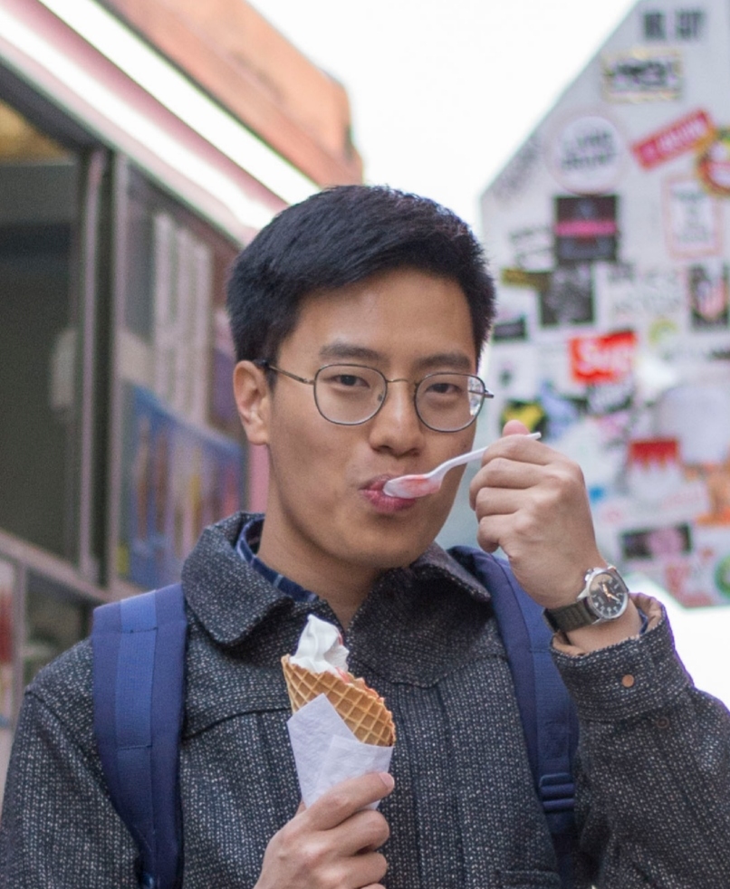 image of man smiling and eating ice cream